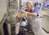 Judy Woods prepares chicken stock for a Thanksgiving dinner Wednesday at Wasilla Lake Church of The Nazarene. Frontline Mission is holding the free community Thanksgiving dinner at the church