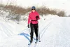 Palmer resident Holly Stephens classic skis into the sun on Tuesday afternoon after a jaunt out Archangel Road. CAITLIN SKVORC/Frontiersman.com
