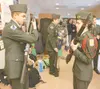 ROBERT DeBERRY/Frontiersman Colony High School JROTC members and
siblings Capshaw Nagel, left, and Abby Nagel work on proper rifle
technique before the regulation armed competition Saturday C