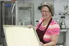 Bev Warble prepares to put a pan of dinner rolls in the convection oven in the new commercial kitchen at Good Shepherd Lutheran Church. Volunteers baked 6,000 dinner rolls in the ovens there 