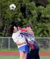 The Soldotna goalkeeper collides with Palmer’s Fischer Adams during a 4-3 win over the Moose in the Division II state semifinals Friday, May 24, 2024, at Wasilla High School. Jeremiah Bartz/F