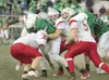 ROBERT DeBERRY/Frontiersman The Wasilla defensive line takes
down Colony sophomore Fischer Summers during Friday’s 42-7 win at
Colony High School. Saturday’s win has moved the Warriors up in 