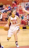 Wasilla senior Celeste Colegrove looks for an open teammate
during Wednesday's game against Oregon's Newberg Tigers during the
Doc Larson's Roundball Classic at Wasilla High School. (ROBERT
D
