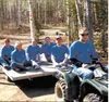 Matanuska Valley Federal Credit Union team members catch a ride to work on campsites at the Girl Scouts’ Camp Togowoods. Submitted photo