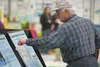 Palmer resident Robert Thom checks out project posters at the Palmer Capital Projects Fair Thursday afternoon at the MTA Events Center in Palmer. ROBERT DeBERRY/Frontiersman.com