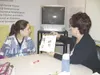 K.T. McKEE/Frontiersman Katie Griffiths, 20, explains to Mat-Su
Borough teacher Mary Putnam Friday how she uses an illustrated
product checklist to assist her in her internship at Mat-Su
Regi
