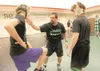 Dave Booth, center, works with a pair of Colony High School wrestlers during a practice in 2007. ROBERT DeBERRY/Frontiersman