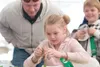 Myra Patterson, 8, concentrates on shelling peas during
Thursday's pea shelling contest as part of the Alaska Grown Games.
(ROBERT DeBERRY/Frontiersman)