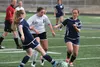 Colony senior Peyton Johnstone tries to split a pair of defenders during a 2-1 Northern Lights Conference loss to Soldotna April 23 at Colony High School. JEREMIAH BARTZ/Frontiersman