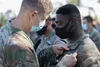 Maj. Gen. James Jarrard, 25th Infantry Division Commanding General, presents 1st Lt. Andrew King, a mortar platoon leader assigned to 2nd Battalion, 35th Infantry Regiment, 3rd Infantry Briga