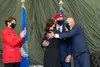 Staff Sgt. Alaxey Germanovich, 26th Special Tactics Squadron combat controller, hugs his mother and father after being awarded the Air Force Cross during a medal ceremony Dec. 10, 2020, at Ca