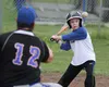 Palmer Pioneers head coach Tim Rockey lobs a ball to his nephew Jacob Rockey during a three-day baseball clinc hosted by the Palmer-based American Legion baseball program. Jacob Rockey, 9, wa