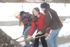 MICHAEL ROVITO/Frontiersman From left, Susitna Valley juniors
Genna Moses, Ariel Moore and Madison Maynard use gold shovels to
throw dirt Friday during the ceremonial groundbreaking for the n