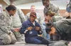 Army Air Corps Staff Sgt. (retired) Leslie Edwards, center, a documented original Tuskegee Airman of the 617th Bombardment Squadron, shares a moment of levity with Reserve Airmen during the 4