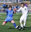 Soldotna junior Luke Trammell (5) fights for possession Friday afternoon against Palmer's Makeehan Knittle at Justin Maile Field in Soldotna. Photo by Joey Klecka/Peninsula Clarion