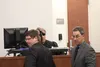 Defense attorney Lyle Stohler and District Attorney Roman Kalytiak react to the decision to end the third day of the Dominic Johnson trial early. Tim Rockey/Frontiersman