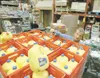 ROBERT DeBERRY/Frontiersman Terry Williams, food assistant
manager for the Palmer Fred Meyer store, counts the first shipment
of Matanuska Creamery milk to arrive for sale at local stores
Thu