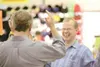 ROBERT DeBERRY/Frontiersman Outdoors and More owner Jerry
Holbrook jokes with a customer Thursday at the Wasilla store.