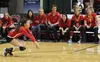 Wasilla players and coaches watch as Denisha Christiansen grabs a dig during a 3-2 win over Kodiak on the second day of the 2015 ASAA/First National Bank 4A State Volleyball Championships in 