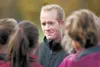 Wasilla High cross-country coach Gary Howell talks to members of his team before the start of the Region III Cross Country Championships at Palmer High School in September 2011. Howell has de