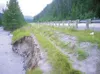 Water from the Matanuska River cuts away a section of bank along
the Glenn Highway. Erosion has prompted crews from the Alaska
Department of Transportation to shore up the area in hopes of
pr