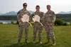 U.S. Air Force Staff Sgt. Jacob Lara, left, Senior Airman Matthew Arellano, and Staff Sgt. Thomas Rodriguez, 25th Air Support Operations Squadron pause for a photo after winning the Chaos Cha