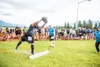 An Alaska Scottish Highland Games athletes hurls a large rock during a competitive event. Frontiersman file photo.