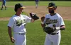 Mat-Su infielder Brandon Chinea bumps fists with outfielder Quin Cotton as Cotton jogs to the dugout during a recent game against the Anchorage Glacier Pilots. Two games against the Pilots we