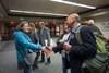 Former state Rep. Les Gara, in front, converses with Kodiak residents on Monday night, while former Gov. Bill Walker, in rear, talks to other residents after the end of a candidate forum on f