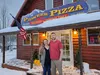 Pioneer Pizza's new owners Chad and Christiana stand in front of the iconic building. Jacob Mann/Frontiersman