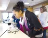Girl Scout Troop 476 member Holly Stock, 12, looks through a
microscope at the gills of a fish Saturday at the Women of Science
&amp; Technology Day held at Mat-Su College. (ROBERT
DeBERRY/Fr