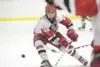 ROBERT DeBERRY/Frontiersman Wasilla sophomore defenseman Chancie
Hanson goes after a loose puck during Friday'€™s game against the
Dimond Lynx in the Curtis C. Menard II Memorial Hockey Tourn