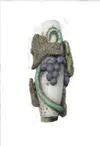 Here is a pic of a bead that was made by torch, then embellished
with Glasclay and fired in a kiln. (Photo courtesy Lisa
Lehrman-Bon)