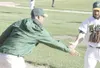 JEREMIAH BARTZ/Frontiersman Mat-Su Miners head coach Brian Yocke
slaps hands with infielder Tim Zier at the end of an inning during
a win over the Anchorage Bucs. Yocke, who helped lead the M