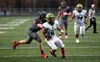 Redington's Ikaia Flores breaks a tackle during a victory over rival Houston. Bruce Eggleston/matsusports.net