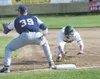 ROBERT DeBERRY/Frontiersman Mat-Su Miner center fielder Dominick
Francia dives back to first base during Thursday’s game against the
Glacier Pilots.
