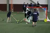 Seahawks mascot Blitz plays hockey with children at the Play 60 event at the Menard Center on Wednesday photos by Tim Rockey / Frontiersman