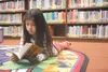 GREG JOHNSON/Frontiersman Audrey Coon, 8, takes time to read
Monday at Cottonwood Creek Elementary School’s annual
Read-A-Thon.
