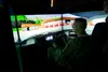 U.S. Air Force Col. Thomas Sherman, Installation Excellence Selection Board member, uses a 673d Security Forces Squadron training simulator during the 2020 Commander in Chief’s Installation E