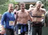 From left to right, Palmer's Eric Strabel, Anchorage's Scott Patterson and Wasilla's AJ Schirack break after smiling for a photo at the finish of the Crow Pass Crossing in Eagle River Nature 