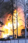 Flames consume a garage at a residence near the intersection of Huckleberry Drive and Blue Spruce Circle Monday evening. HEATHER A. RESZ/Frontiersman