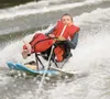 ROBERT DeBERRY/Frontiersman Dalton Dietrich, 12, skims across
the water at Finger lake during the Challenge Alaska Summer Splash
event Saturday.