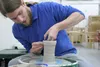 Matthew Van Atta forms a vessel of clay on a potter's wheel in his studio at 4740 Greenstreet Circle in Wasilla on Jan. 1. Van Atta grew up in Kodiak, graduated from the University of Alaska 