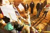 (ROBERT DeBERRY/Frontiersman) Alaska Gov. Sarah Palin greets
loyal supporters, signs autographs and hugs close friends behind
wasilla City Hall early Tuesday morning.