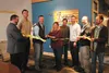 City officials and members of the Sustainable Design Group cut the ribbon to celebrate the opening of ‘The Annex,’ a rental office space and business pollinator on South Alaska Street in Palm