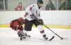 Houston blueliner Zach Lovelace takes control of the puck during
the Hawks game against Wasilla Saturday afternoon in Wasilla.
(ROBERT DeBERRY/Frontiersman)