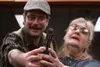 Mathew Firman attempts to teach Christine Lloyd to shoot as characters readying for a duel in a rehearsal of Anton Chekov's "The Boor," a one-act comedy written in the late 19th century. Firm
