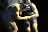 Palmer senior Levi Farris keeps a grip on Eagle River's Jaron Alf during a dual against the Wolves Thursday at Palmer High. Farris pinned Alf to earn his 124th career win, a program record. J