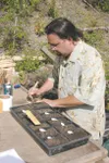 J.J. HARRIER/ Frontiersman Alpine Garden Nursery owner Jaime
Rodriguez labels his seeded plants outside his garden in
Palmer.