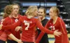 Wasilla senior Emily Rushing (7) gathers her team as Wasilla celebrates a point during a 3-1 win over rival Colony in the quarterfinals of the ASAA/First National Bank 4A State Volleyball Cha
